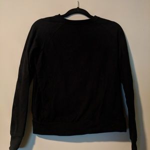 Open back black Fabletics sweatshirt